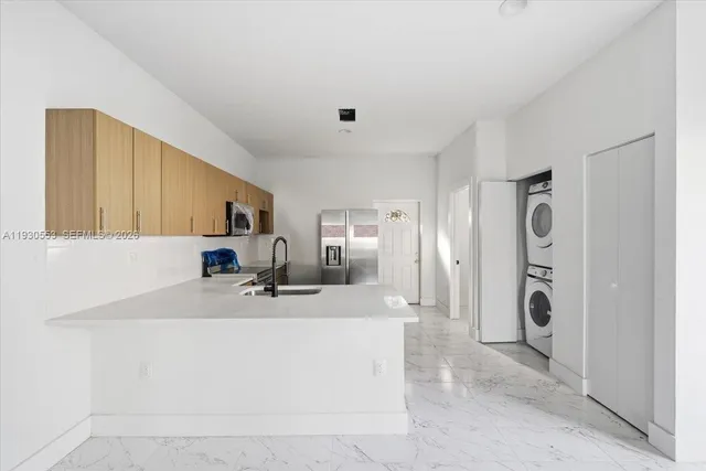 a bathroom with a sink a mirror and shower