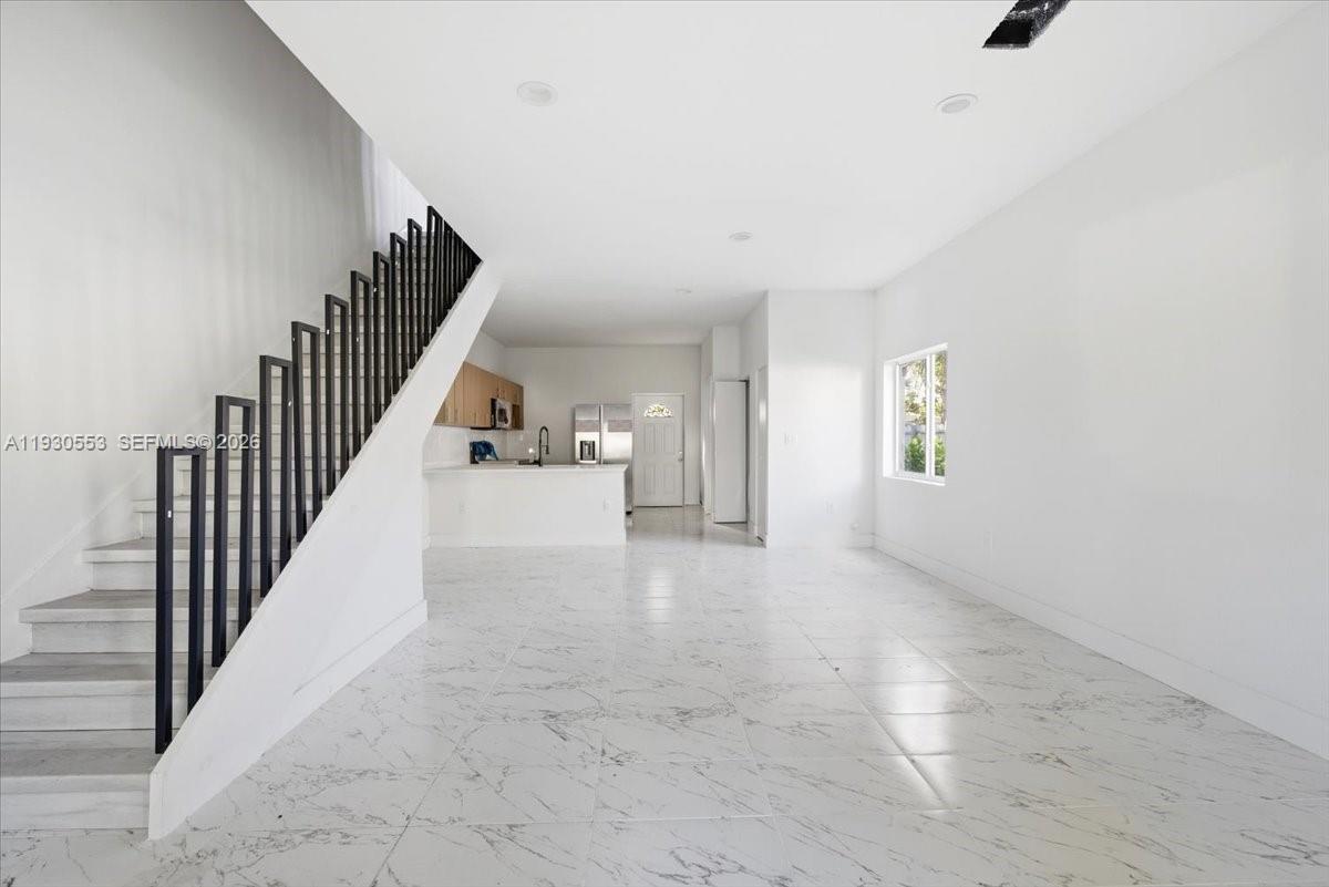 1126 Northwest 28th Street, Unit 1126 Miami, FL 33127 - Photo 3 of 26 a view of entryway and hall with wooden floor
