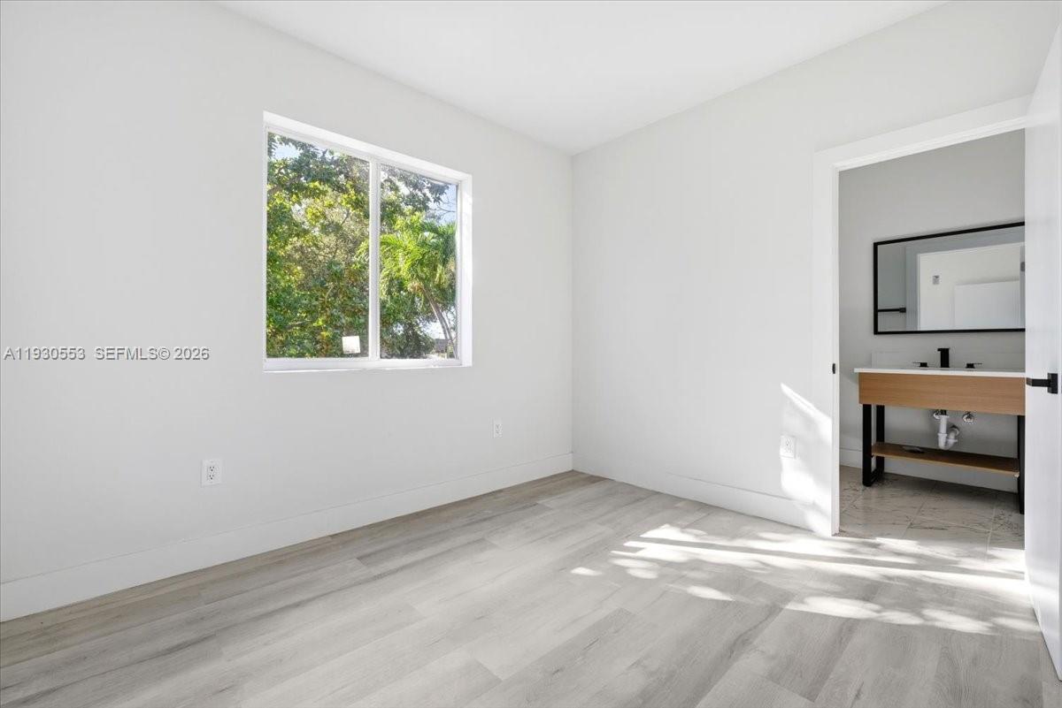 1126 Northwest 28th Street, Unit 1126 Miami, FL 33127 - Photo 5 of 26 a view of a room with a window