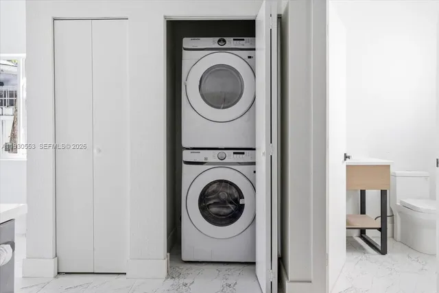 a utility room with dryer and washer