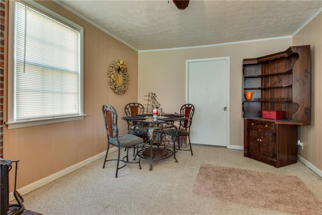 313 Gates Road Goodlettsville, TN 37072 - Photo 9 of 19 The den is also an option for a dining space not far from the kitchen. The door leads to a large laundry closet with washer and dryer.