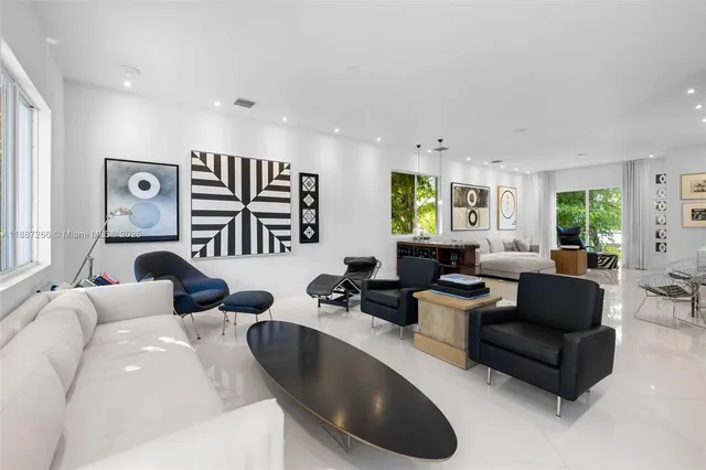 a living room with furniture or couch and a large window