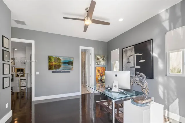 a workspace with furniture and window