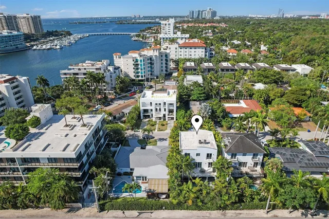 an aerial view of a city with lake view