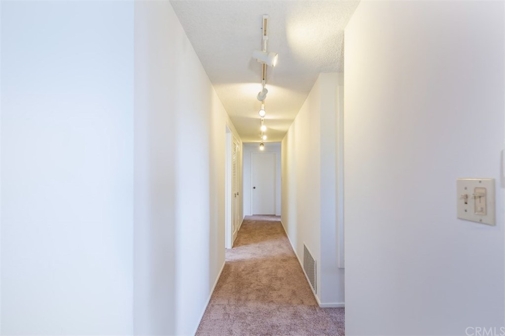 1844 Upper Rim Rock Road Laguna Beach, CA 92651 - Photo 17 of 38 a view of a hallway with wooden floor