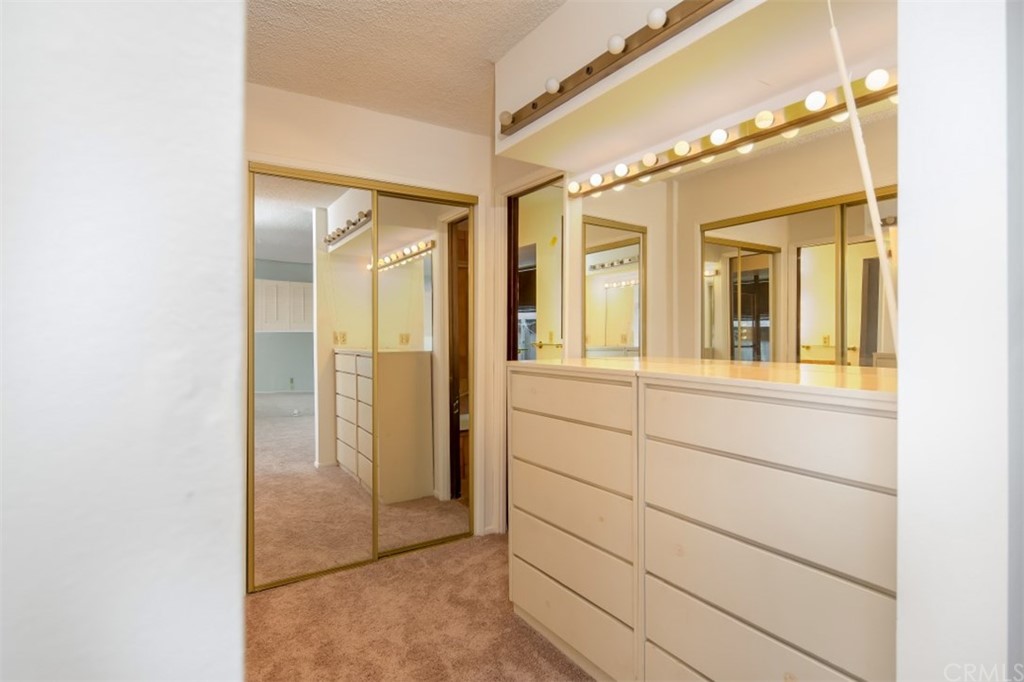 1844 Upper Rim Rock Road Laguna Beach, CA 92651 - Photo 23 of 38 a view of a bathroom with a glass door shower and sink