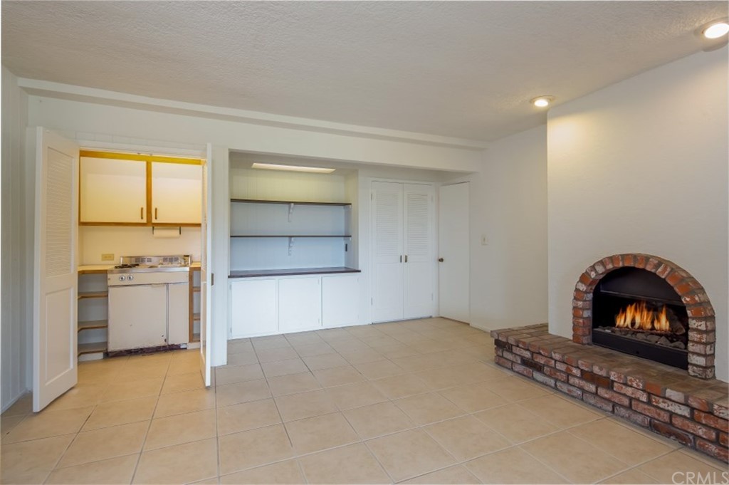 1844 Upper Rim Rock Road Laguna Beach, CA 92651 - Photo 31 of 38 a view of a room with a fireplace and window