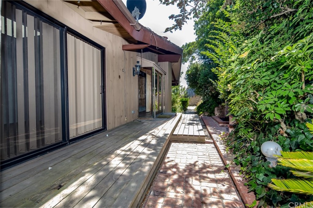 1844 Upper Rim Rock Road Laguna Beach, CA 92651 - Photo 37 of 38 a view of a pathway of a house with potted plants