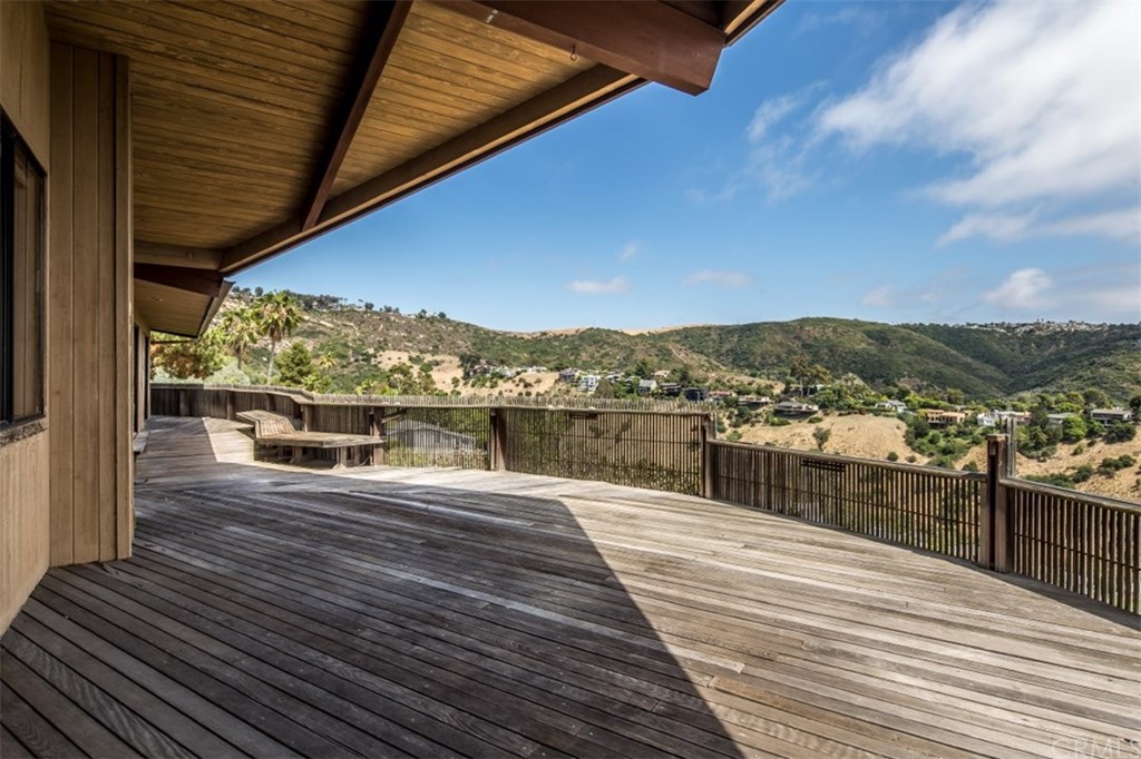 1844 Upper Rim Rock Road Laguna Beach, CA 92651 - Photo 9 of 38 a view of a balcony with wooden floor
