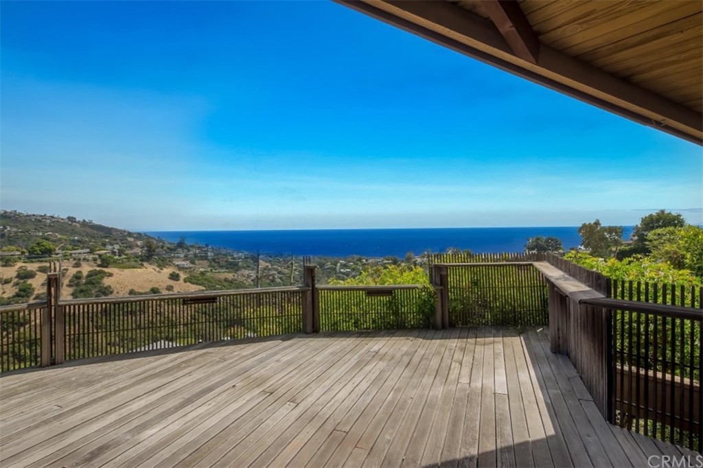 1844 Upper Rim Rock Road Laguna Beach, CA 92651 - Photo 10 of 38 a view of a balcony with wooden floor and city view