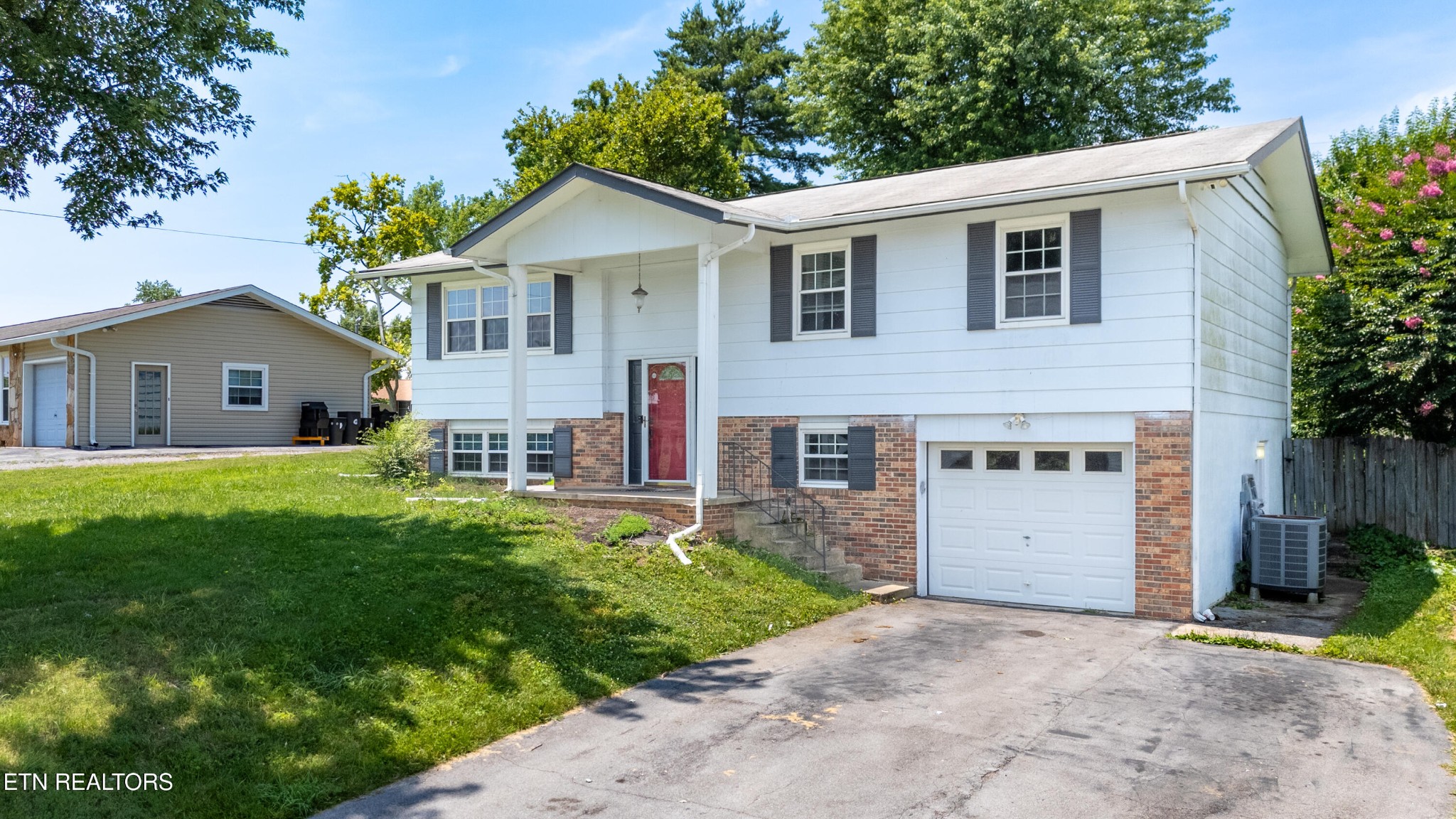7725 Cranley Road Powell, TN 37849 - Photo 2 of 43 a view of house with a yard and potted plants
