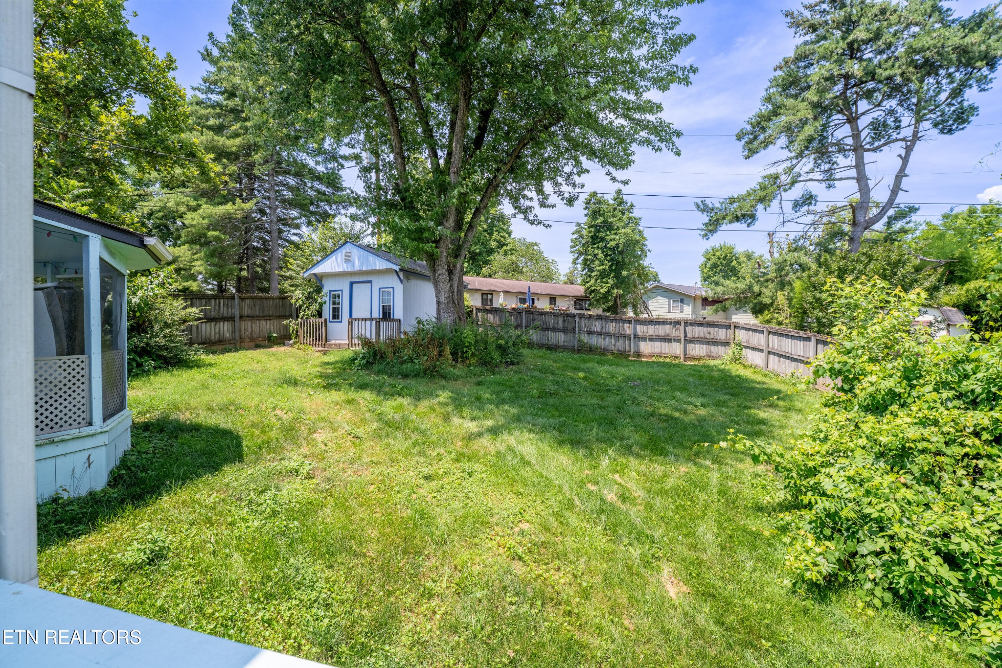 7725 Cranley Road Powell, TN 37849 - Photo 28 of 43 a view of a house with a big yard and large tree