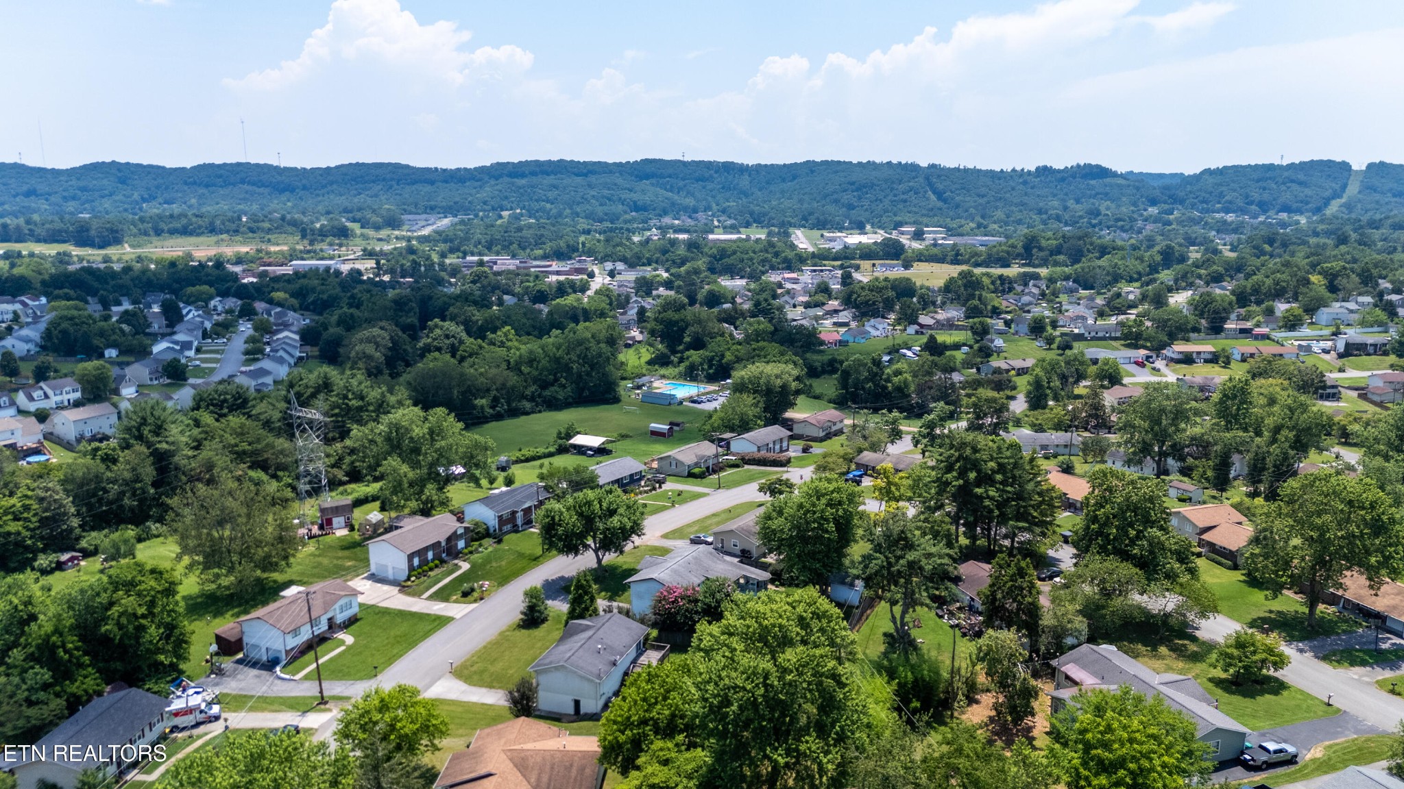 7725 Cranley Road Powell, TN 37849 - Photo 38 of 43 a view of a city with lush green forest