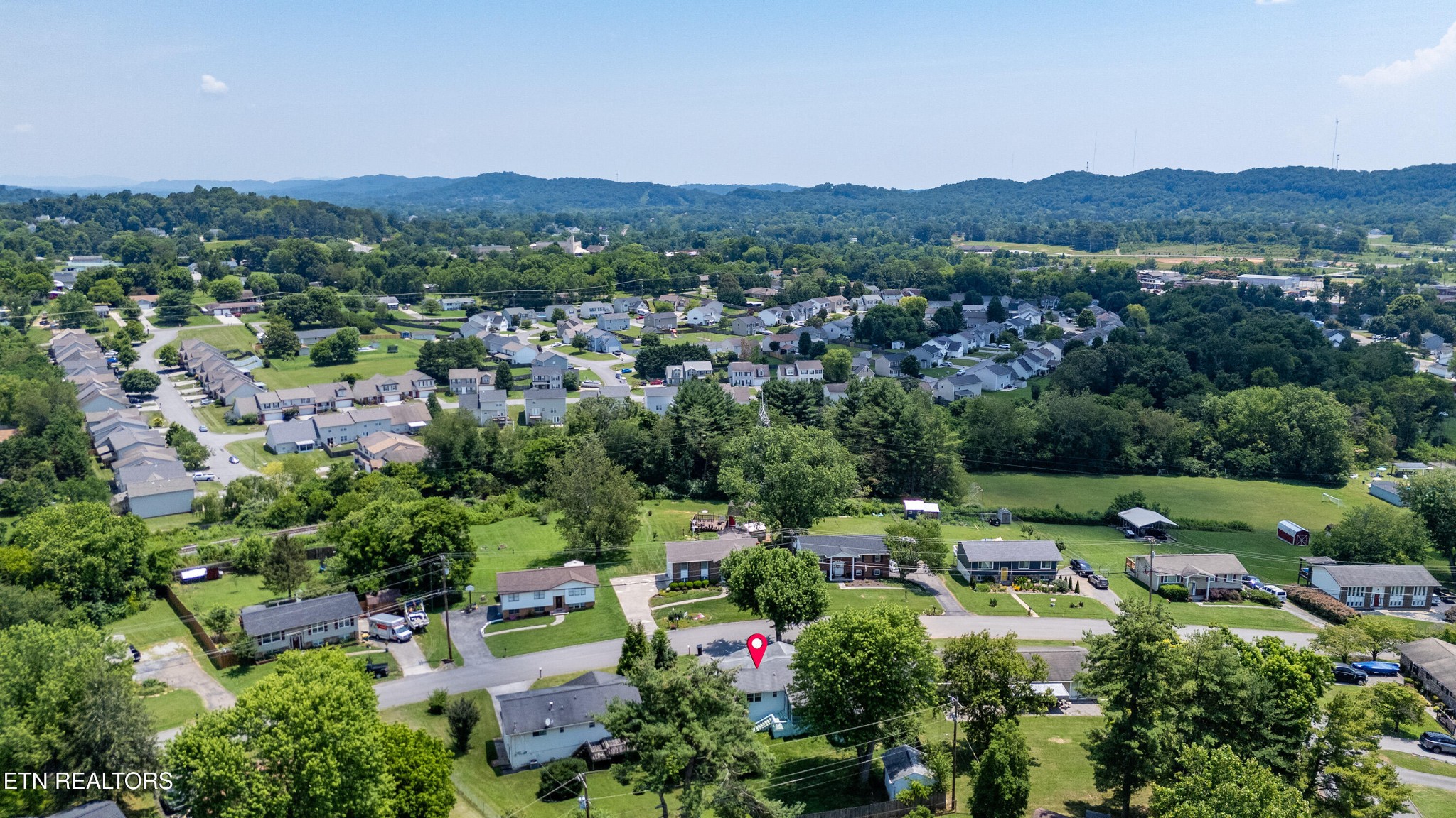 7725 Cranley Road Powell, TN 37849 - Photo 39 of 43 an aerial view of a town with trees