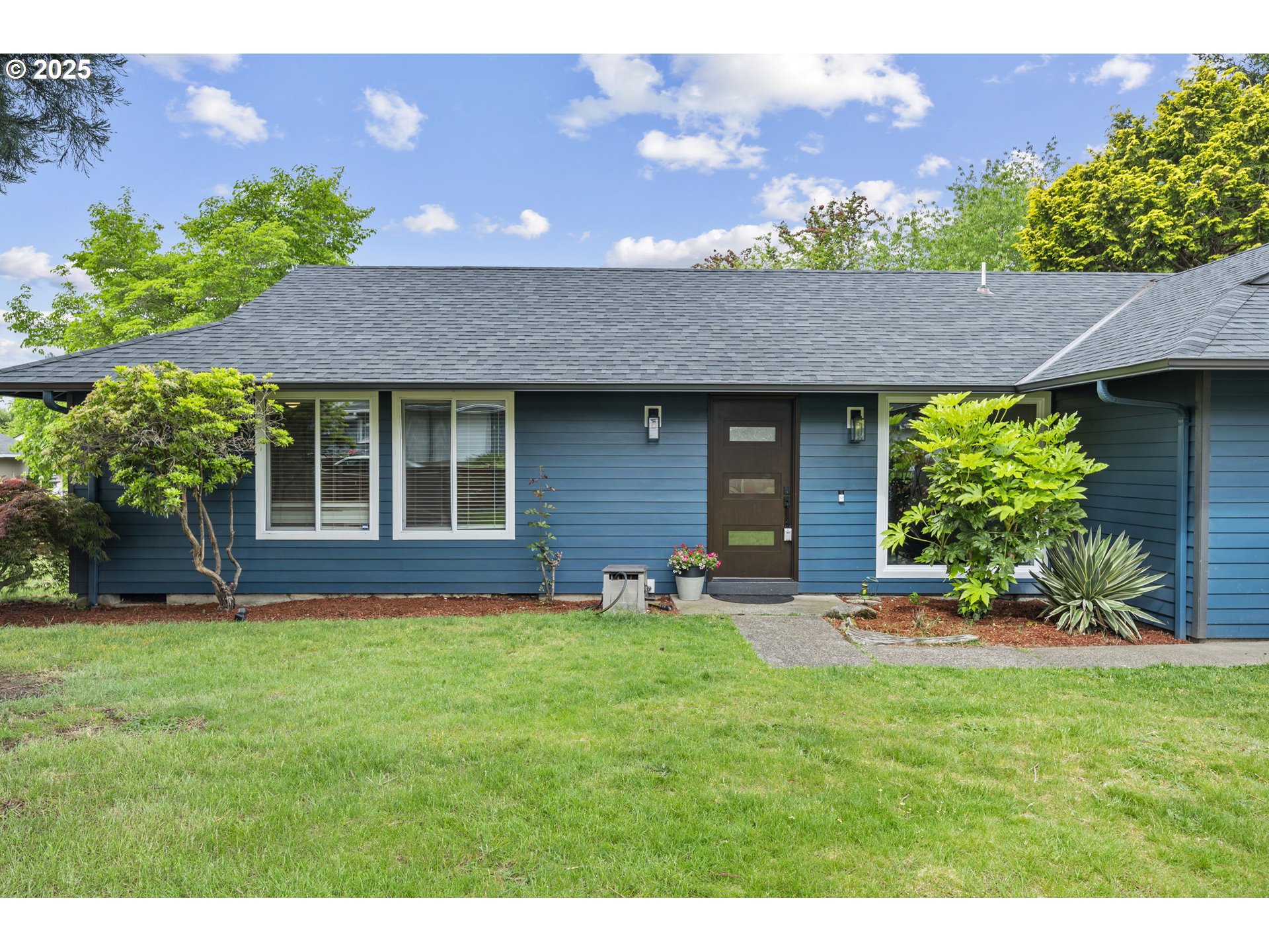 a front view of a house with a yard