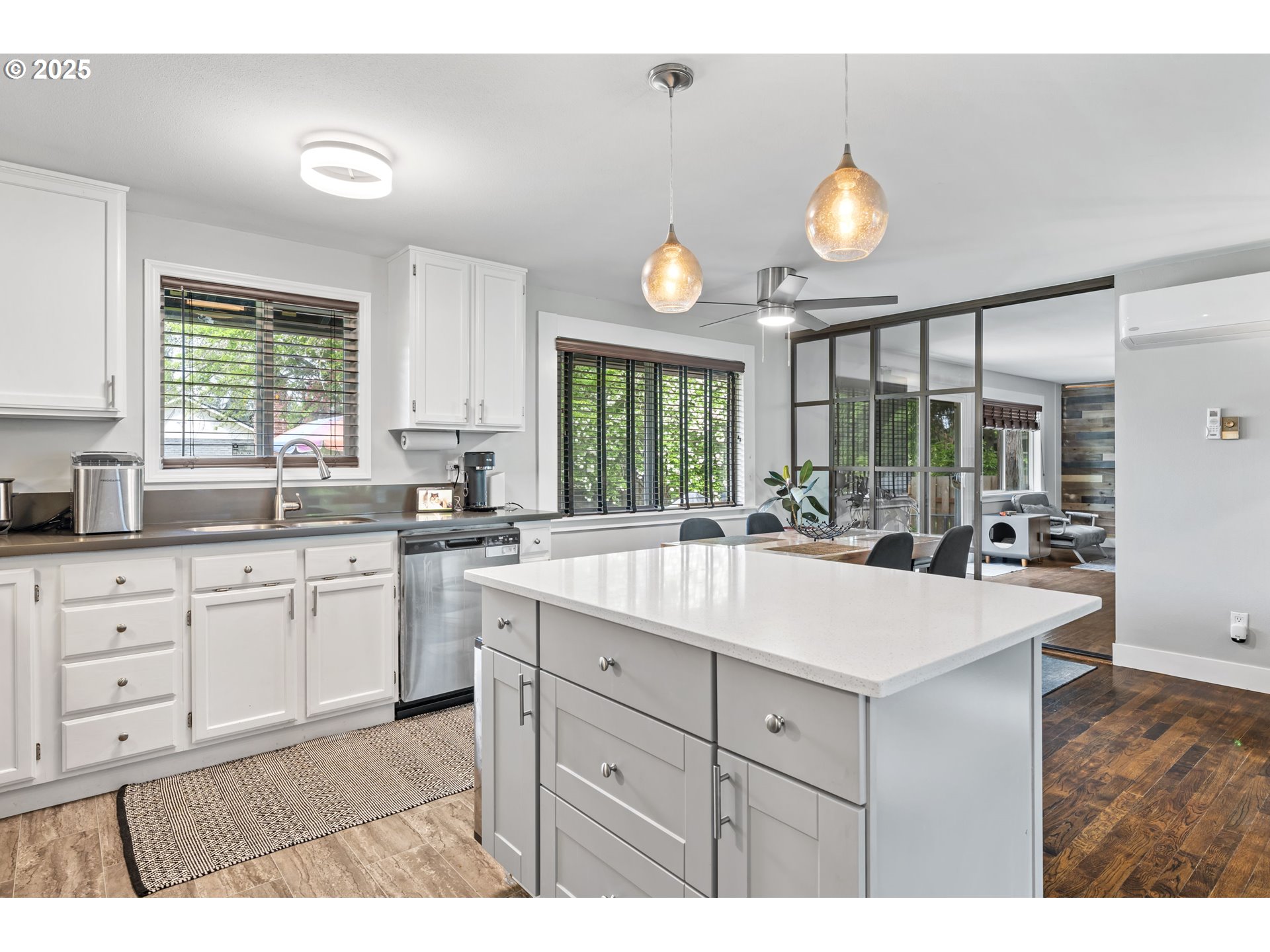 1245 Southeast 211th Avenue Gresham, OR 97030 - Photo 12 of 36 a large white kitchen with a large window