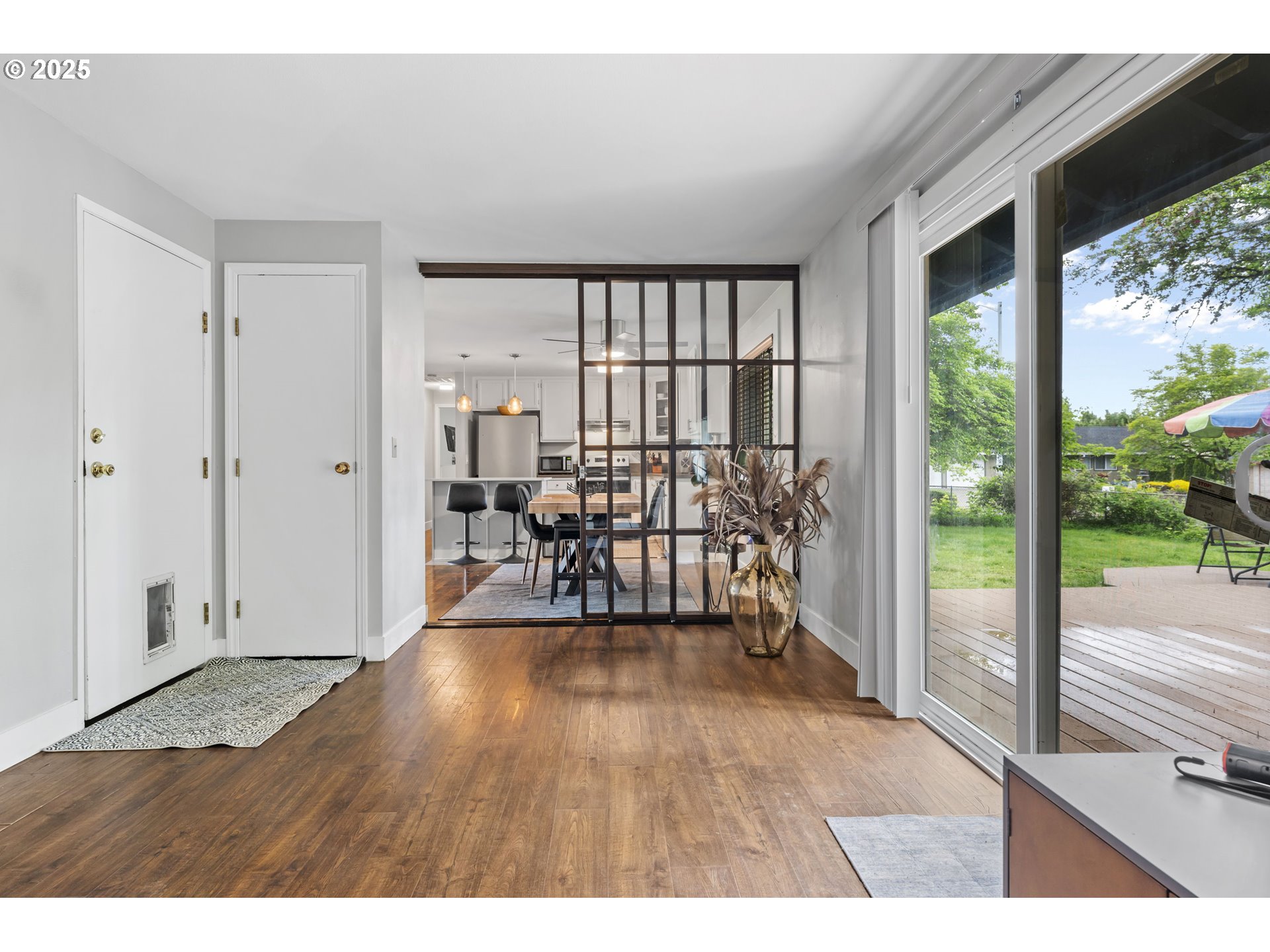 1245 Southeast 211th Avenue Gresham, OR 97030 - Photo 17 of 36 a view of an entryway with wooden floor