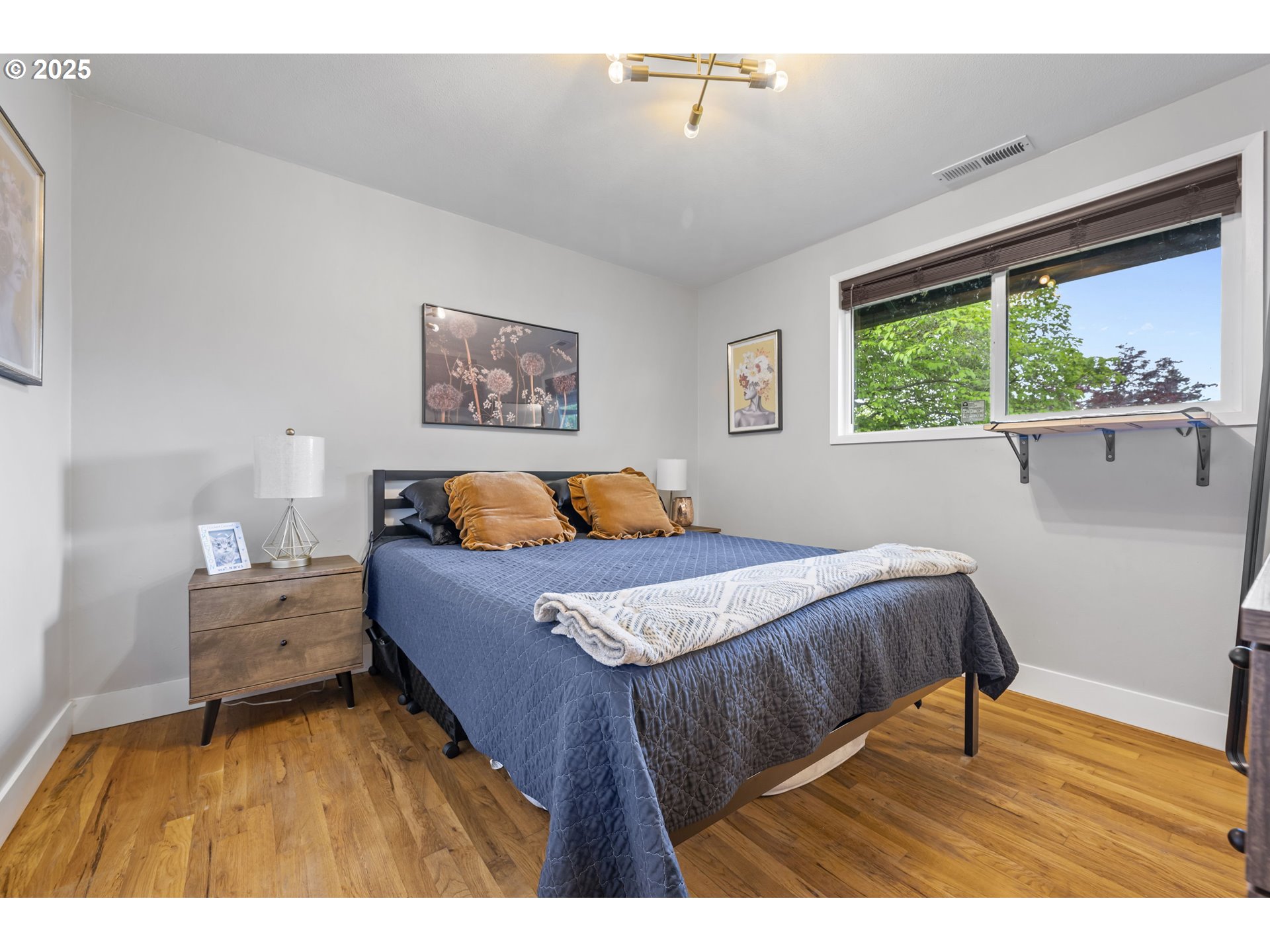 1245 Southeast 211th Avenue Gresham, OR 97030 - Photo 22 of 36 a bedroom with a bed and a large window