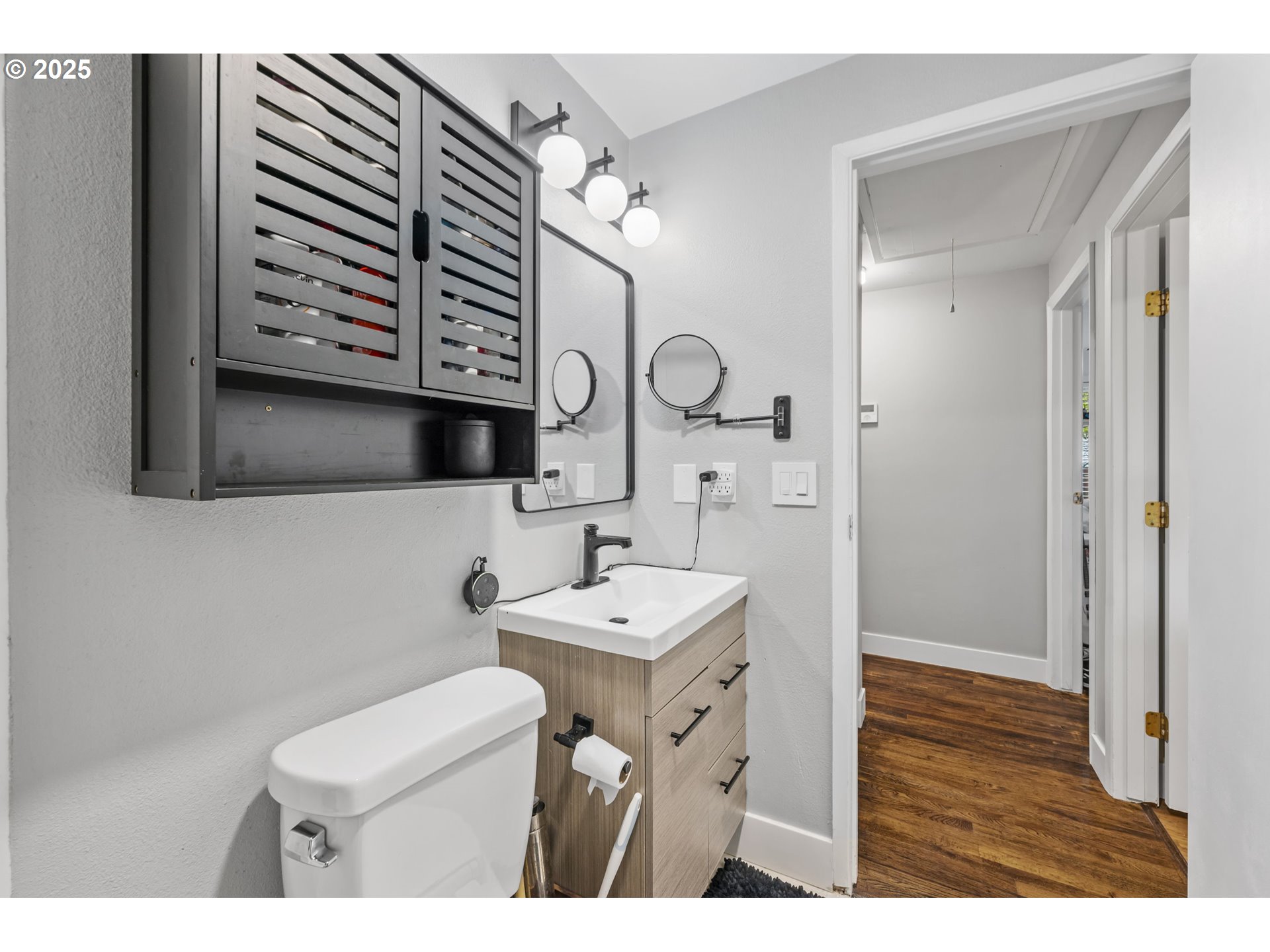 1245 Southeast 211th Avenue Gresham, OR 97030 - Photo 25 of 36 a bathroom with a sink a mirror and a toilet