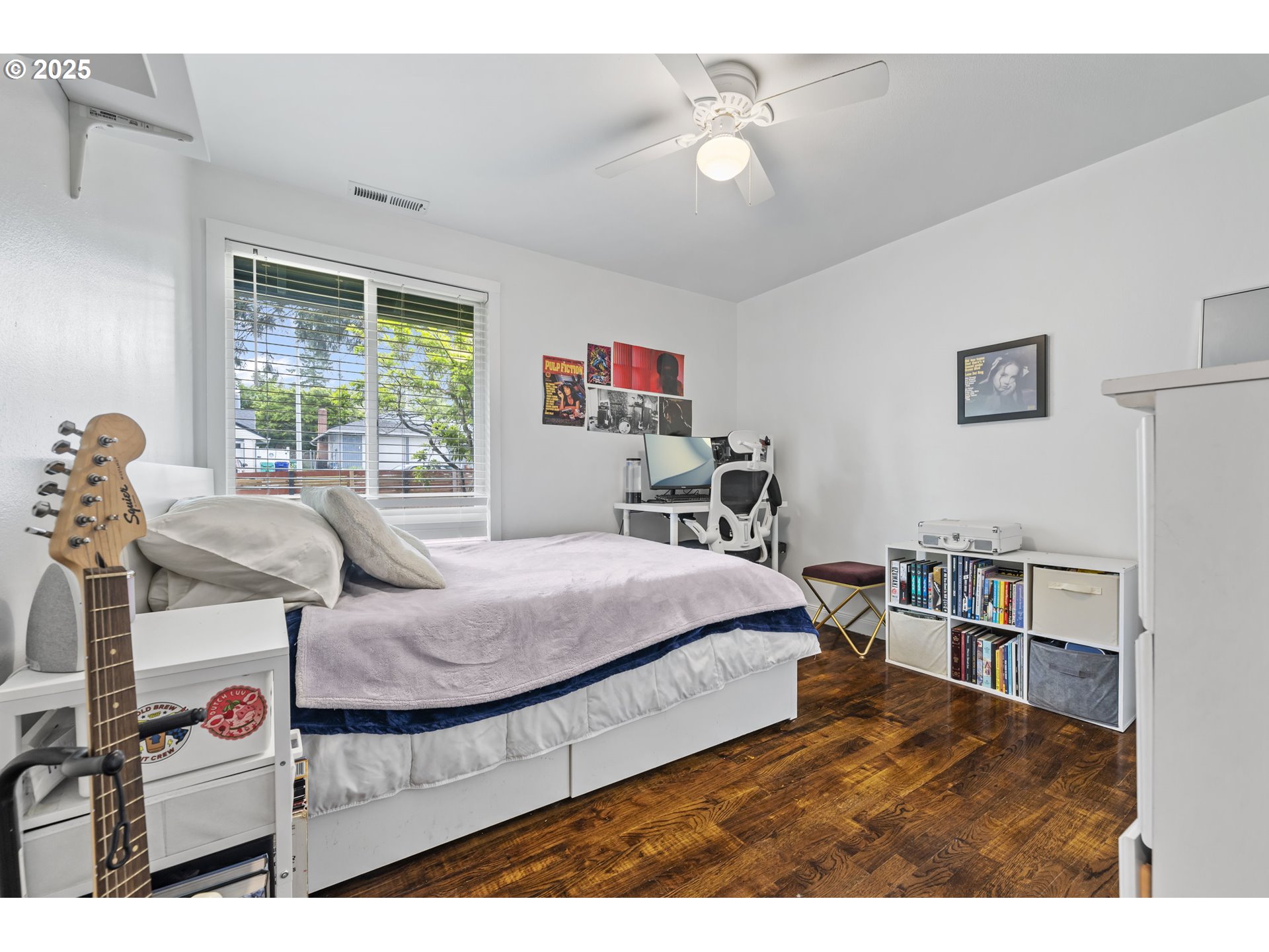 1245 Southeast 211th Avenue Gresham, OR 97030 - Photo 28 of 36 a bedroom with a bed and a bookshelf with the shoe rack