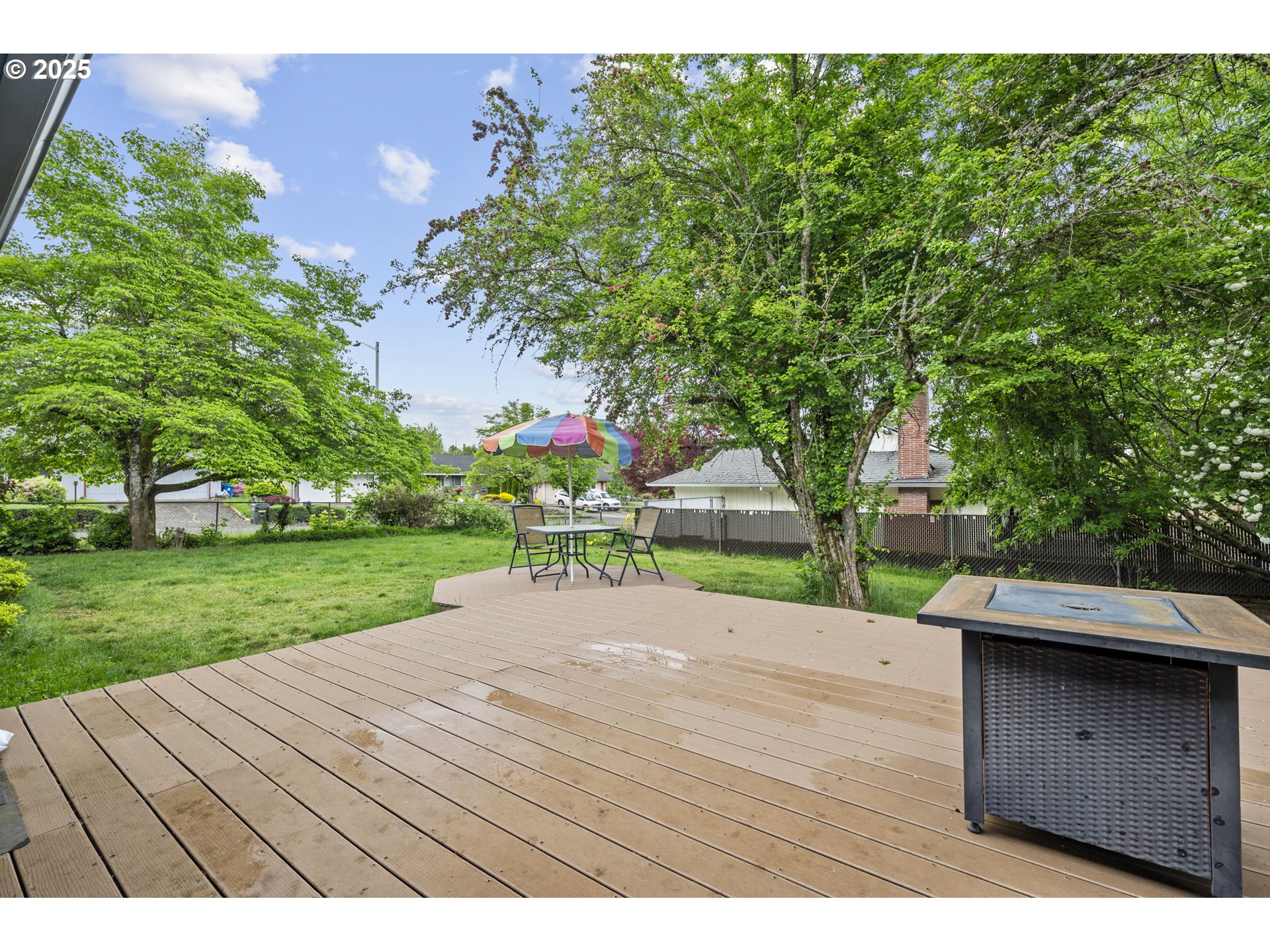 1245 Southeast 211th Avenue Gresham, OR 97030 - Photo 30 of 36 a wooden bench sitting in the middle of a park