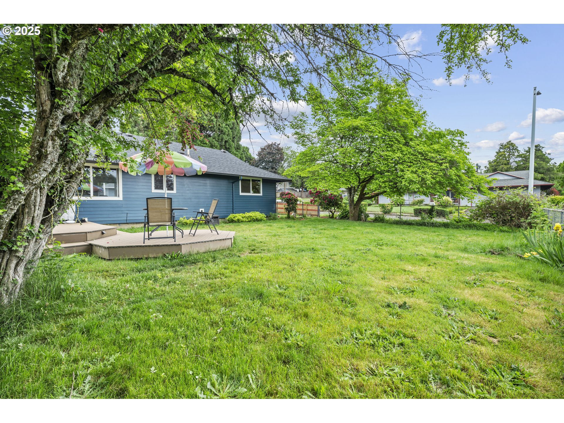 1245 Southeast 211th Avenue Gresham, OR 97030 - Photo 33 of 36 a front view of a house with garden