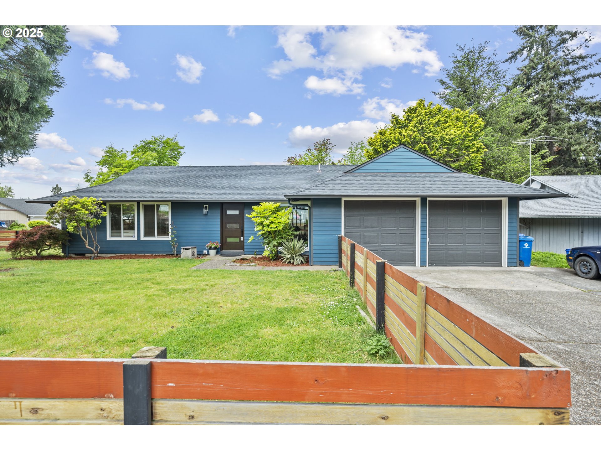 1245 Southeast 211th Avenue Gresham, OR 97030 - Photo 4 of 36 a front view of a house with a yard