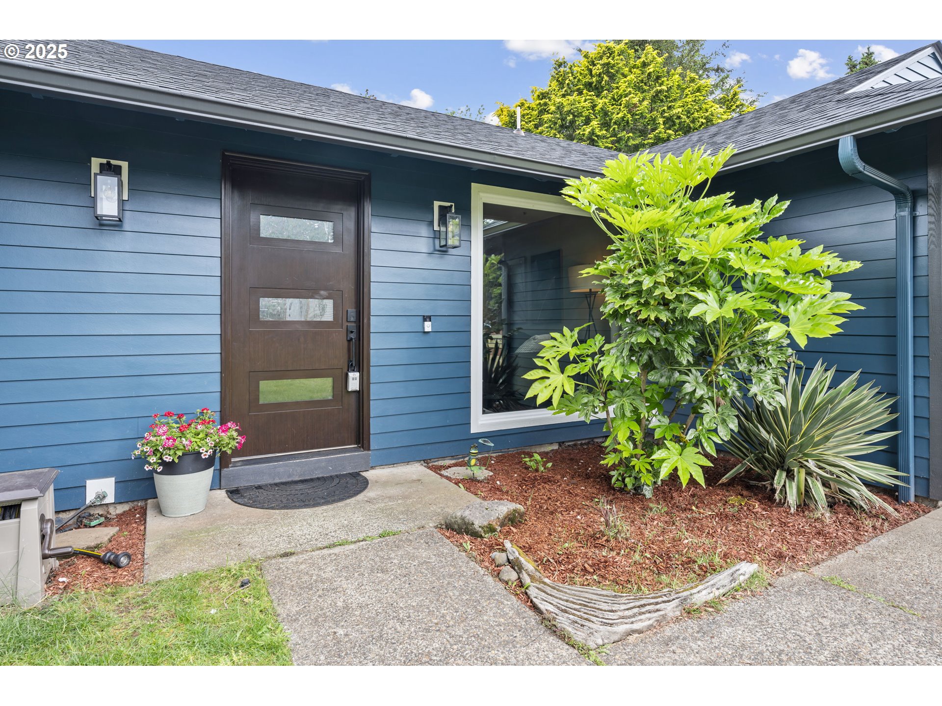 1245 Southeast 211th Avenue Gresham, OR 97030 - Photo 5 of 36 a front view of a house with a yard