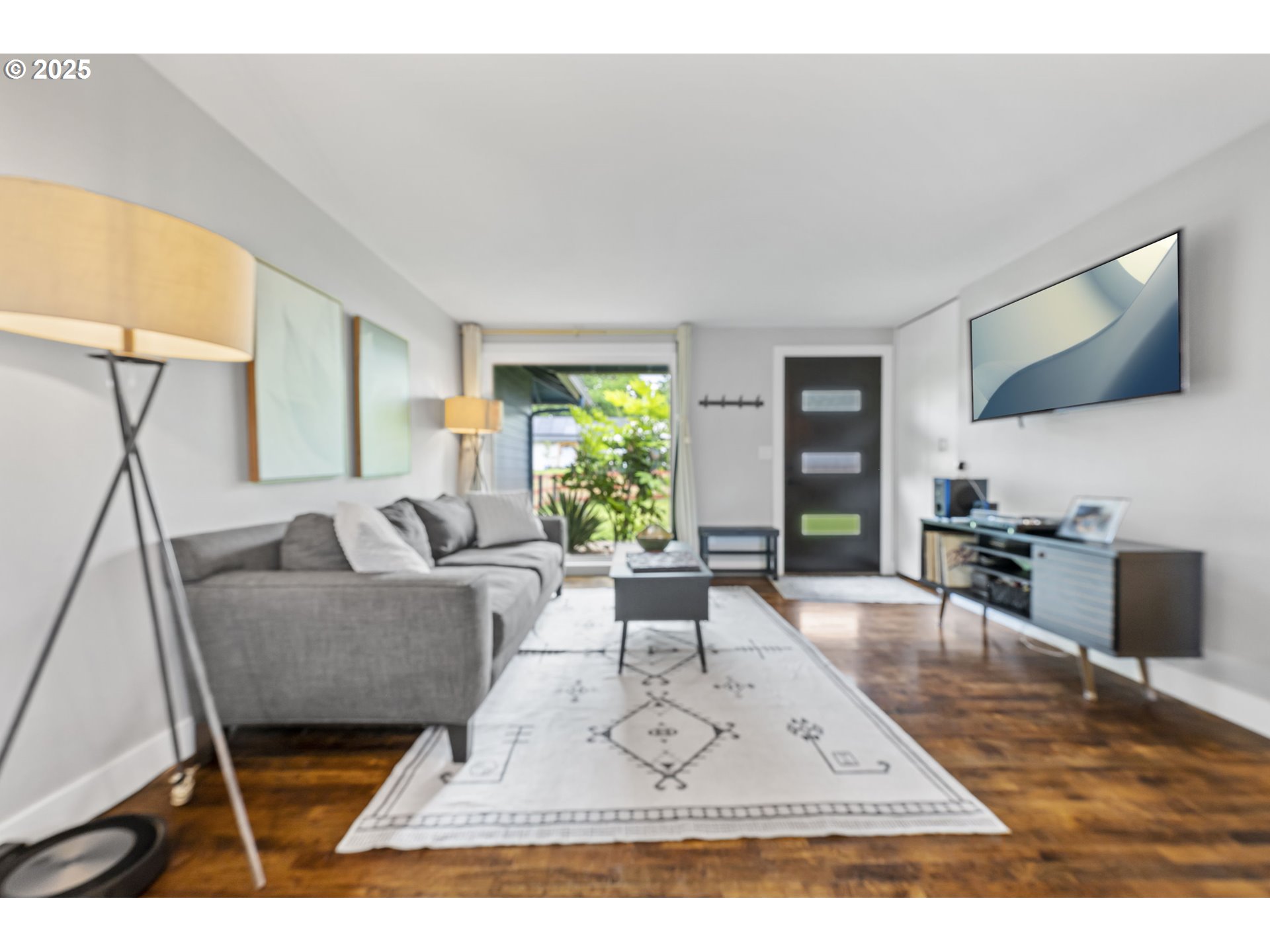 1245 Southeast 211th Avenue Gresham, OR 97030 - Photo 7 of 36 a living room with furniture and a flat screen tv
