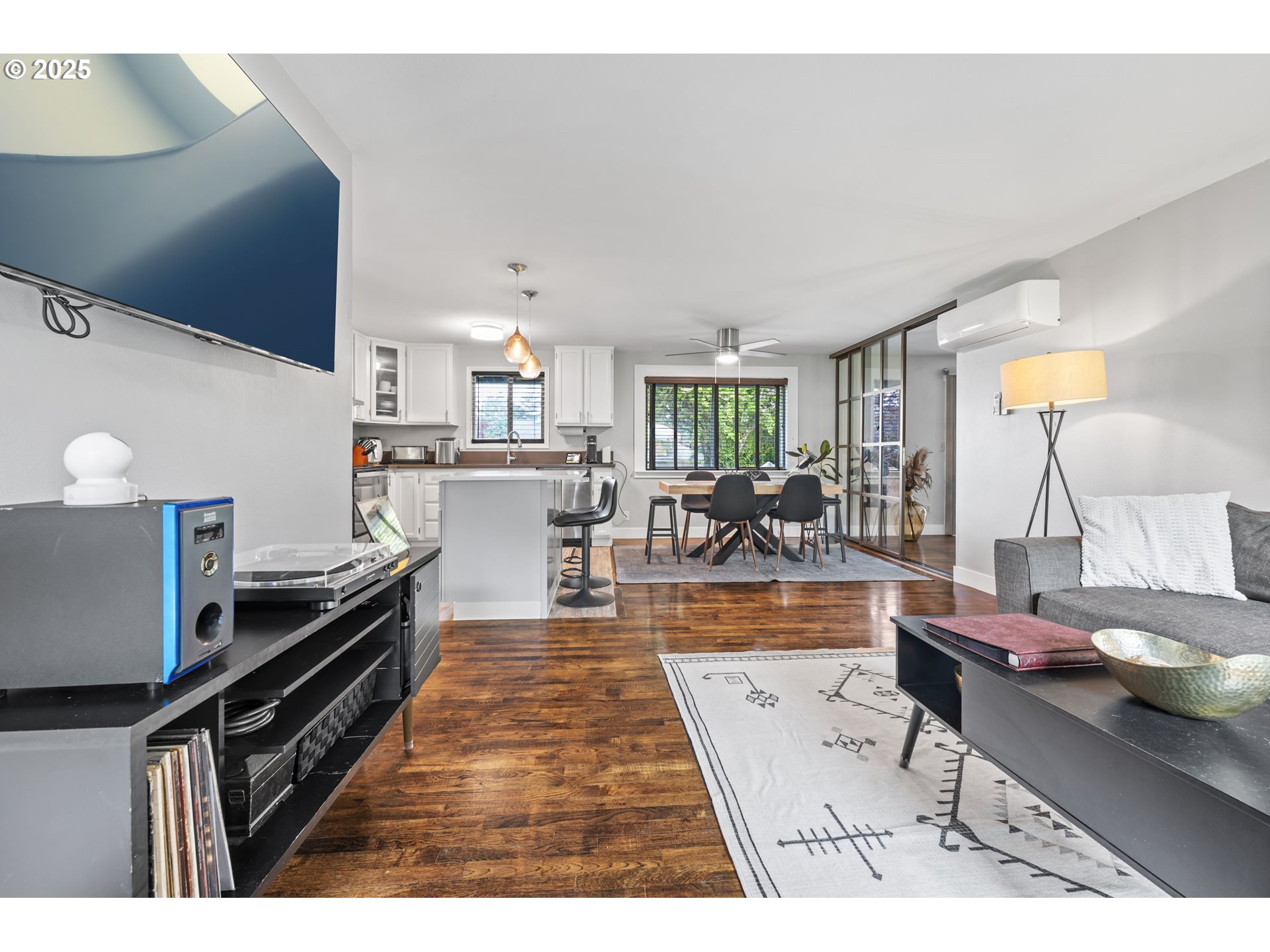 1245 Southeast 211th Avenue Gresham, OR 97030 - Photo 8 of 36 a living room with stainless steel appliances kitchen island granite countertop furniture and a view of kitchen
