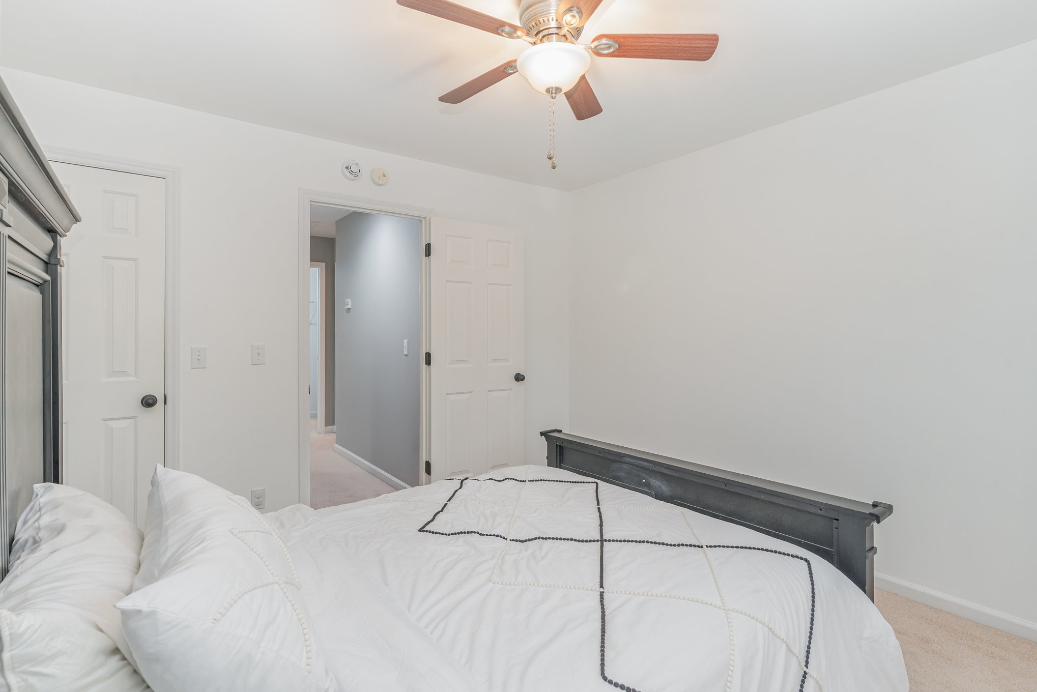 2822 Apache Moon Terrace Murfreesboro, TN 37127 - Photo 20 of 31 a bedroom with a bed and a chandelier