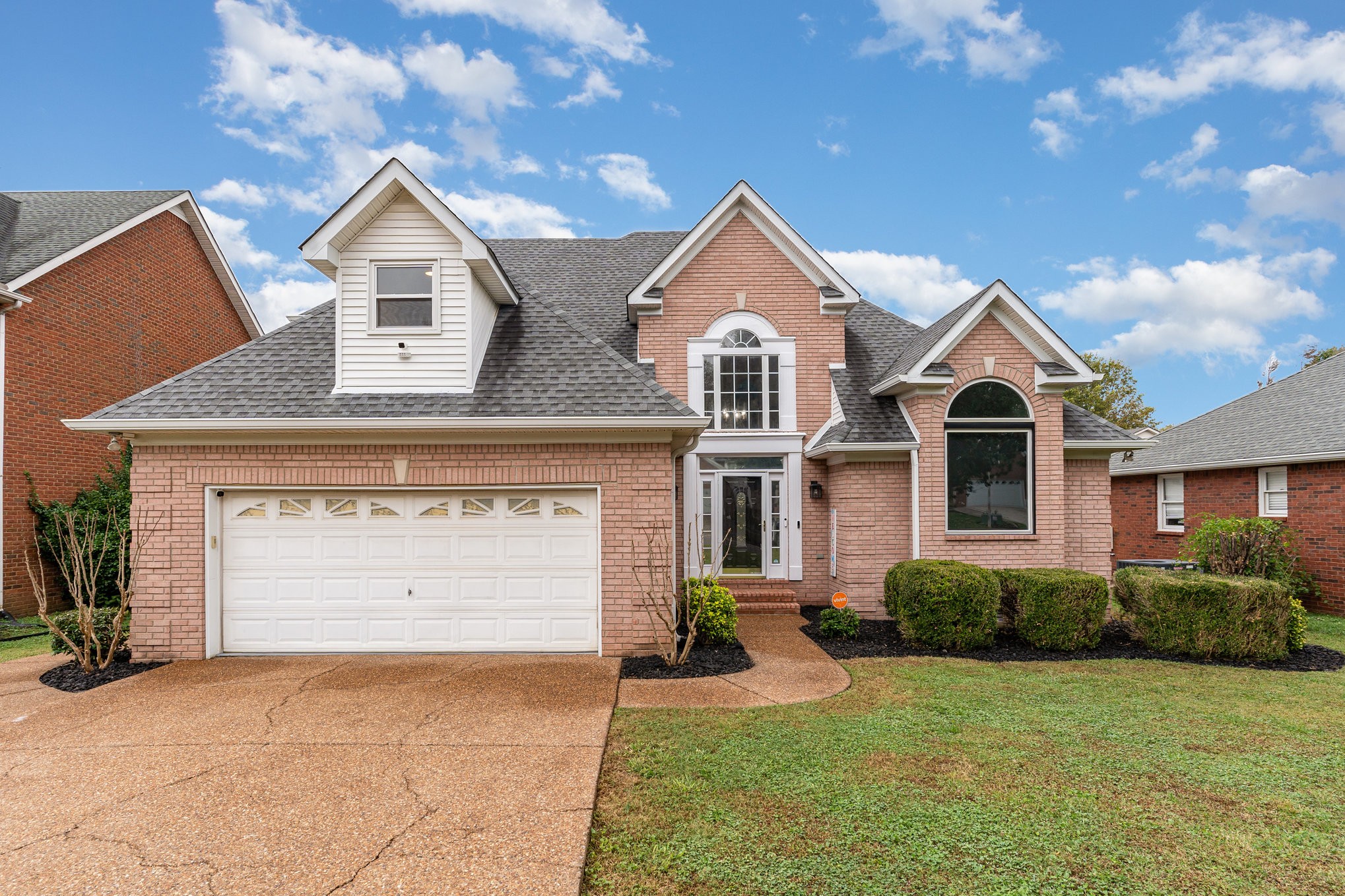 2822 Apache Moon Terrace Murfreesboro, TN 37127 - Photo 2 of 31 a front view of a house with a yard and garage