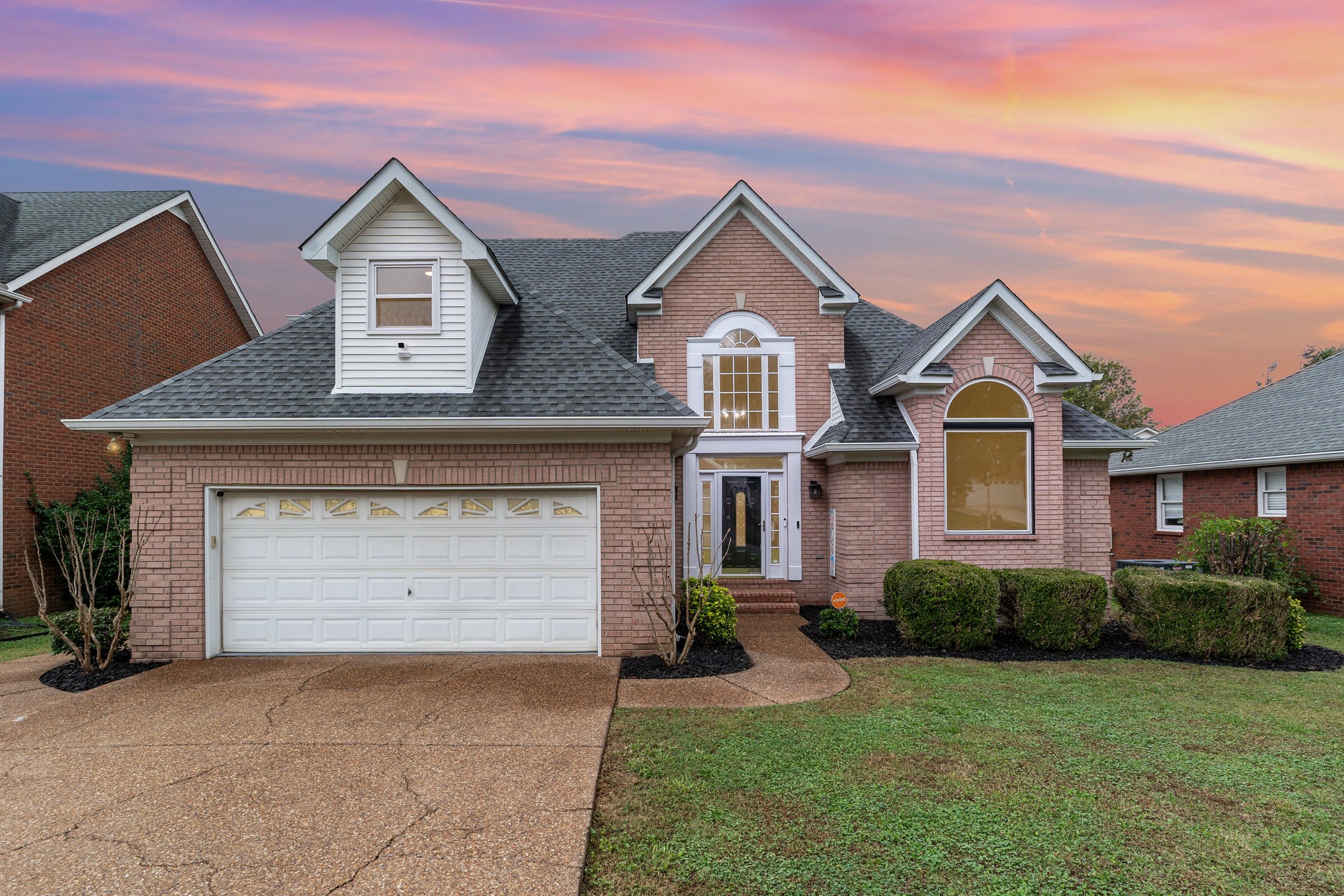2822 Apache Moon Terrace Murfreesboro, TN 37127 - Photo 4 of 31 a front view of a house with a yard and garage