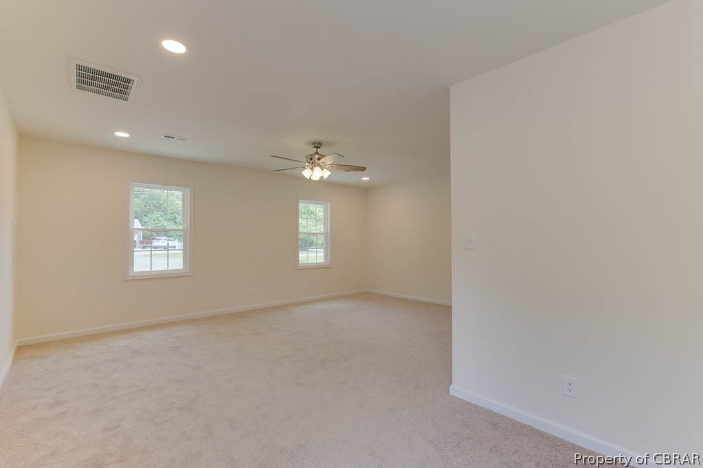 400 Showalter Road Yorktown, VA 23692 - Photo 28 of 49 Spare room with carpet floors, ceiling fan, and plenty of natural light