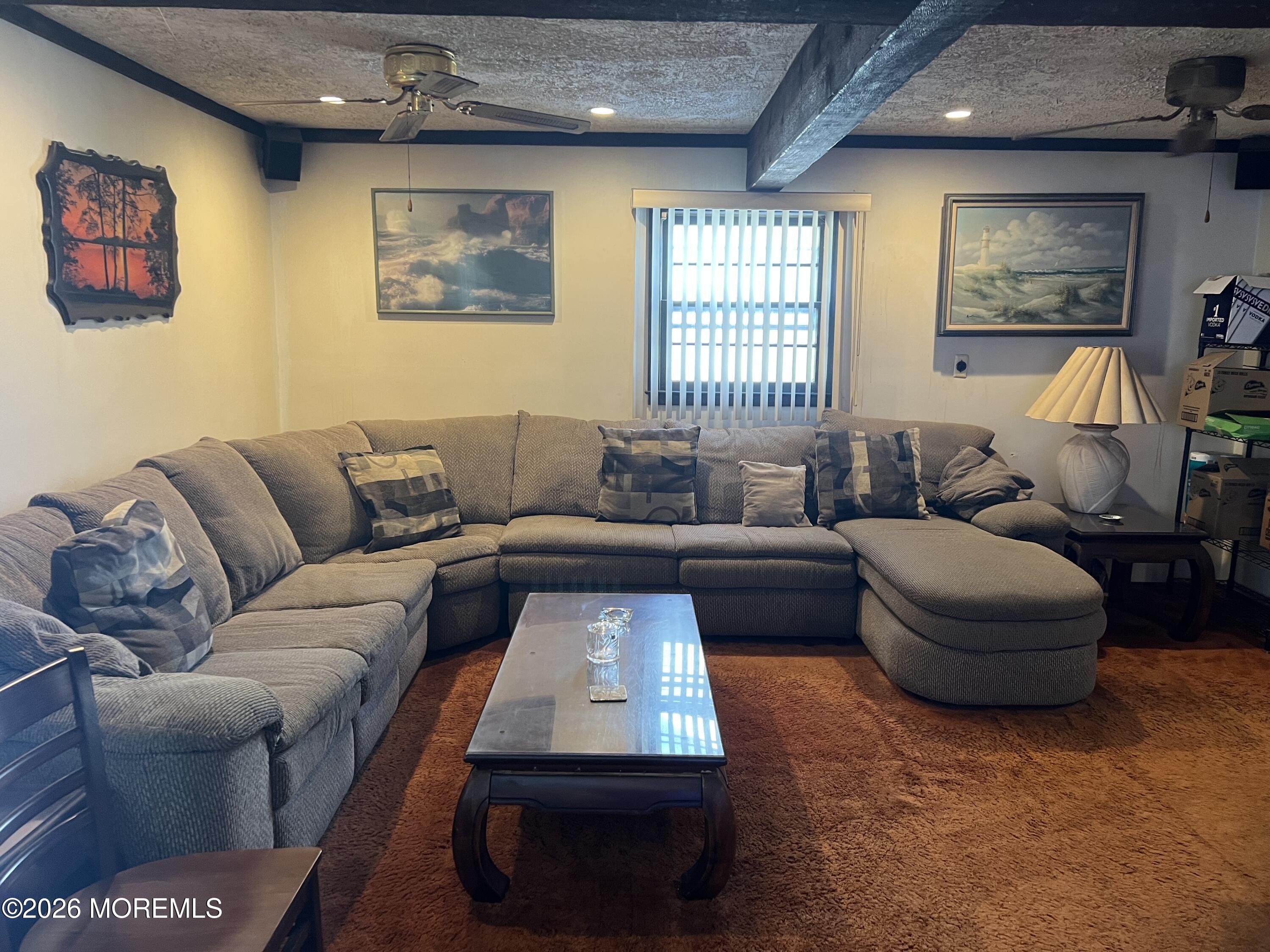 571 Hopping Road Belford, NJ 07718 - Photo 1 of 29 a living room with furniture and a window