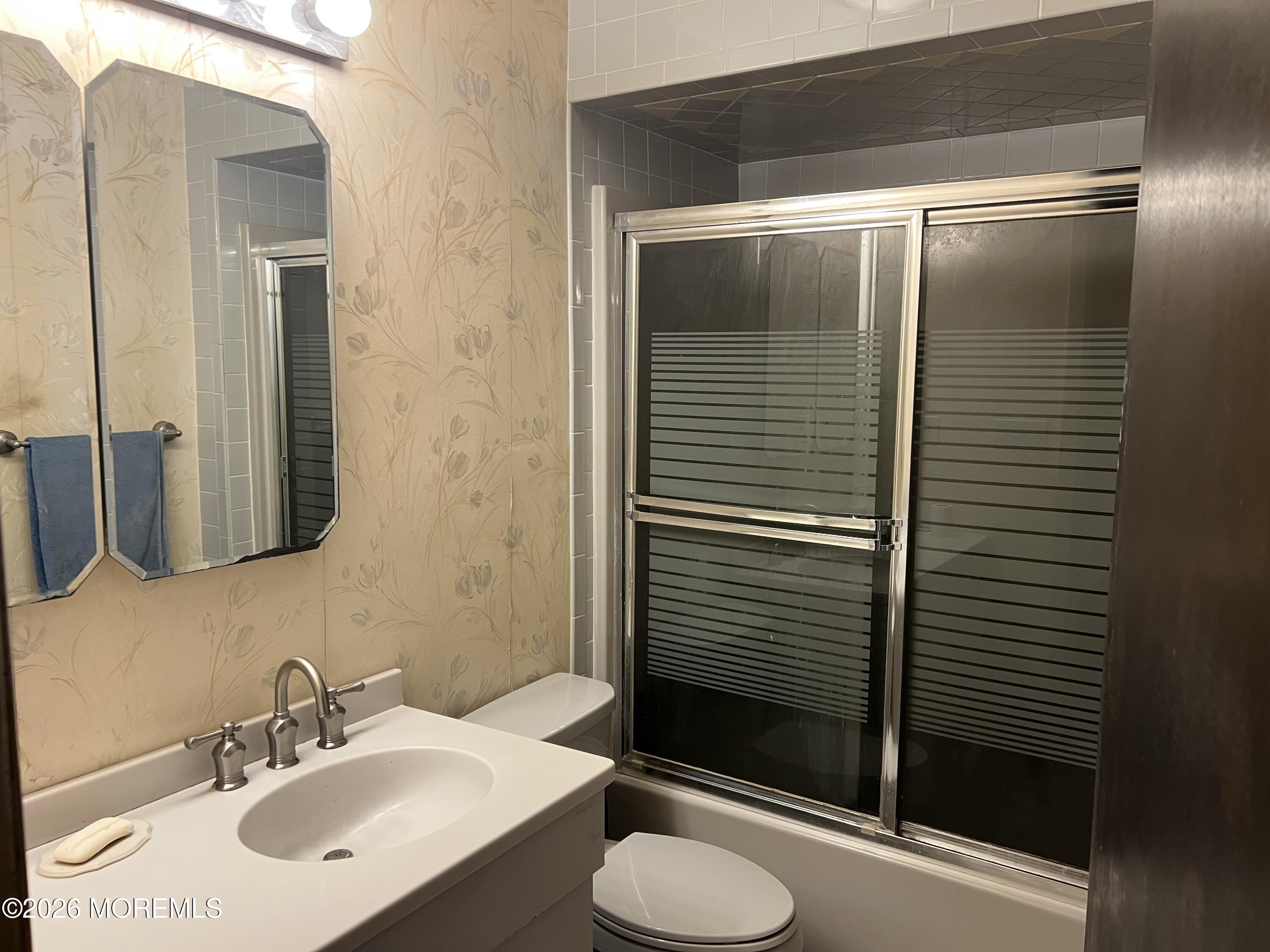 571 Hopping Road Belford, NJ 07718 - Photo 12 of 29 a bathroom with a sink toilet and shower