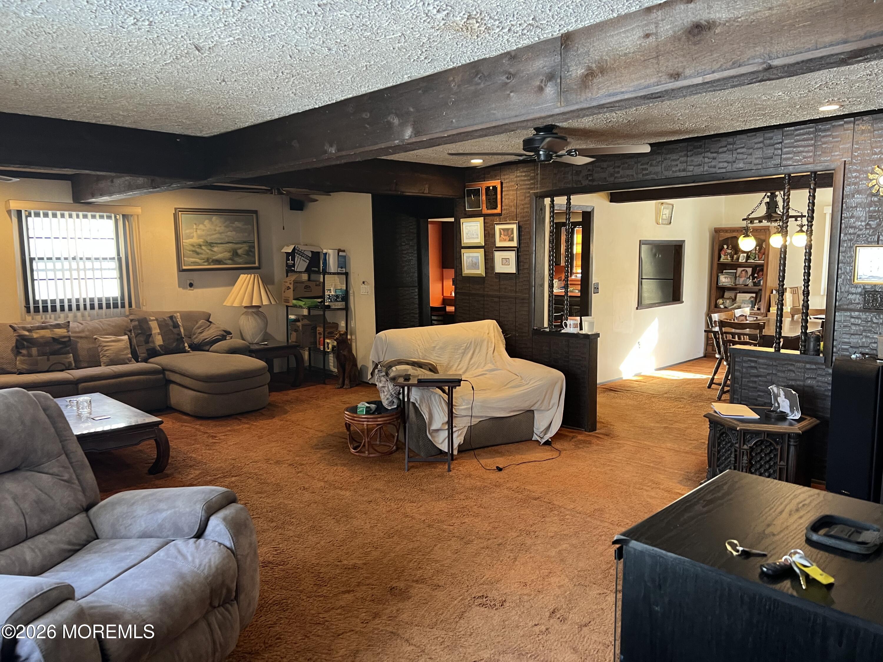 571 Hopping Road Belford, NJ 07718 - Photo 22 of 29 a living room with furniture and a large window