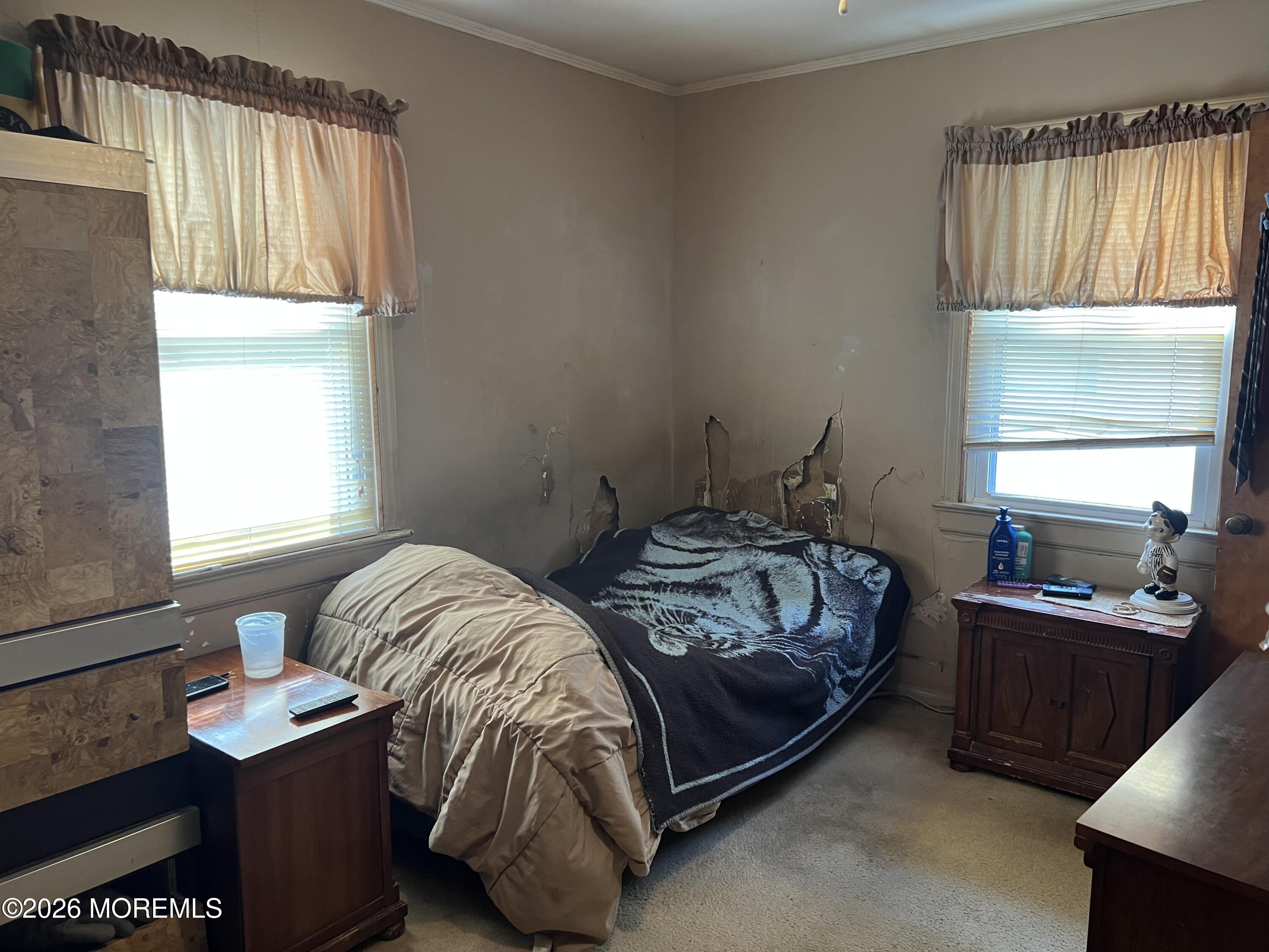 571 Hopping Road Belford, NJ 07718 - Photo 28 of 29 a bedroom with a bed and a window