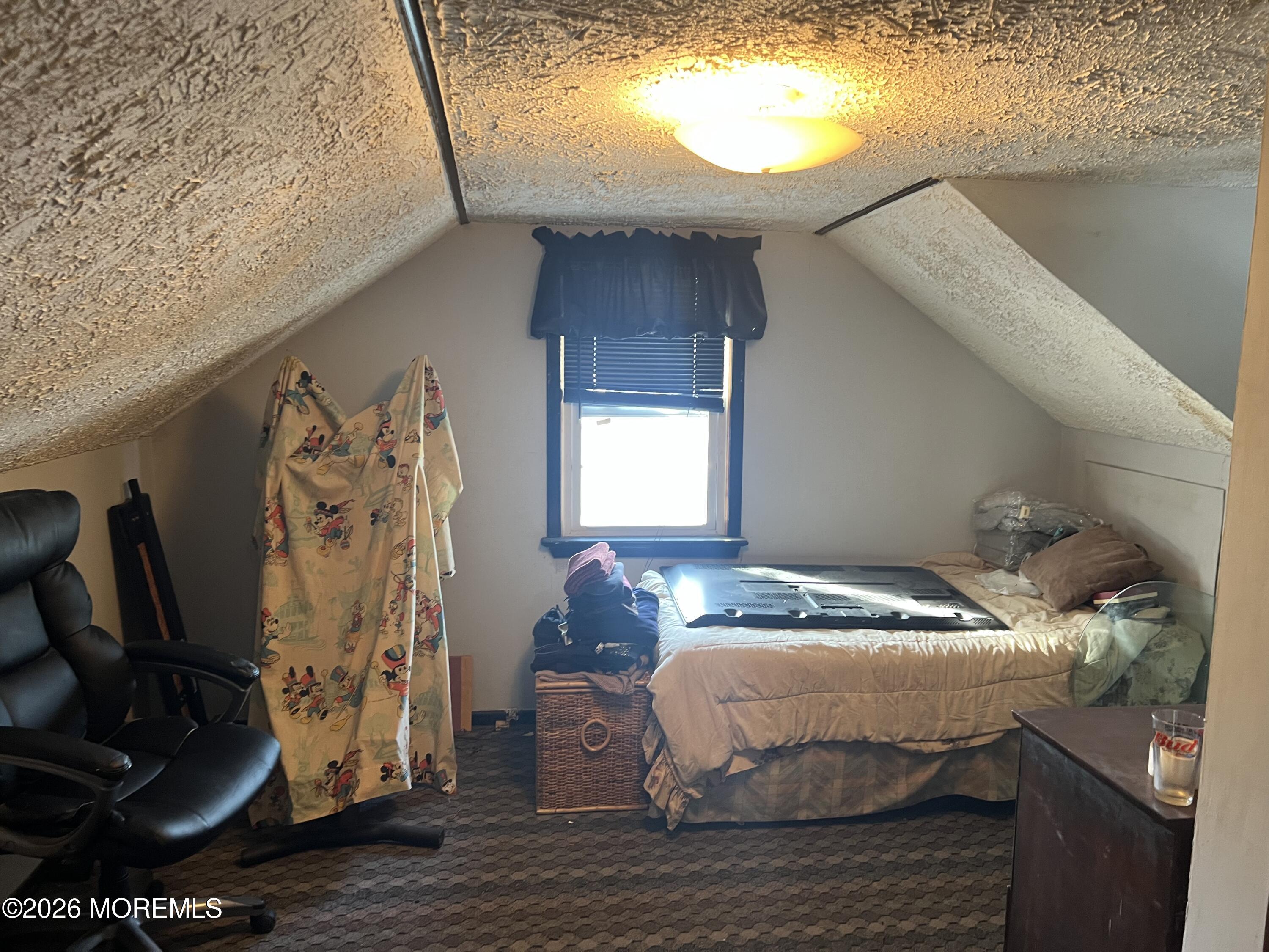 571 Hopping Road Belford, NJ 07718 - Photo 8 of 29 a bedroom with a bed and a window