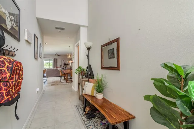 a living room with furniture plant and a potted plant