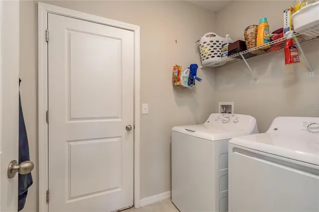 a utility room with dryer and washer