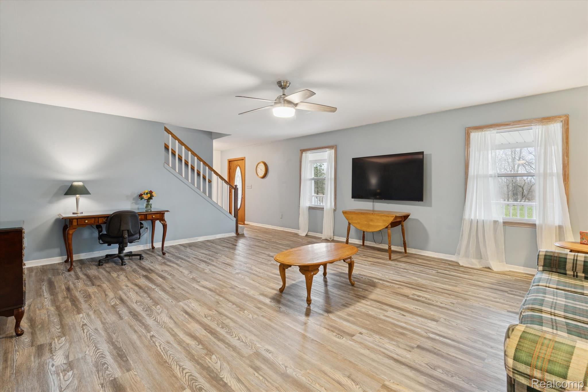 3031 Cedar Point Howell, MI 48843 - Photo 11 of 51 Living area featuring plenty of natural light, light wood-type flooring, an office area, and ceiling fan