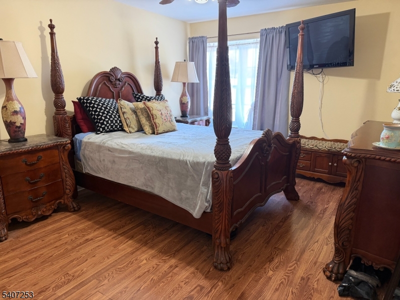 15 Rhea Run, Unit 15 Newton, NJ 07860 - Photo 16 of 19 a bedroom with a bed and wooden floor