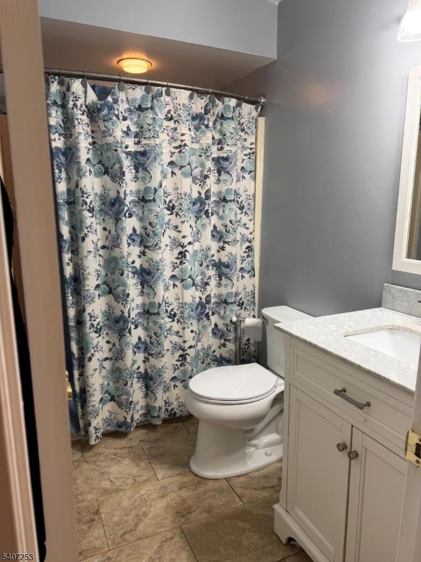 15 Rhea Run, Unit 15 Newton, NJ 07860 - Photo 17 of 19 a bathroom with a granite countertop toilet and a sink