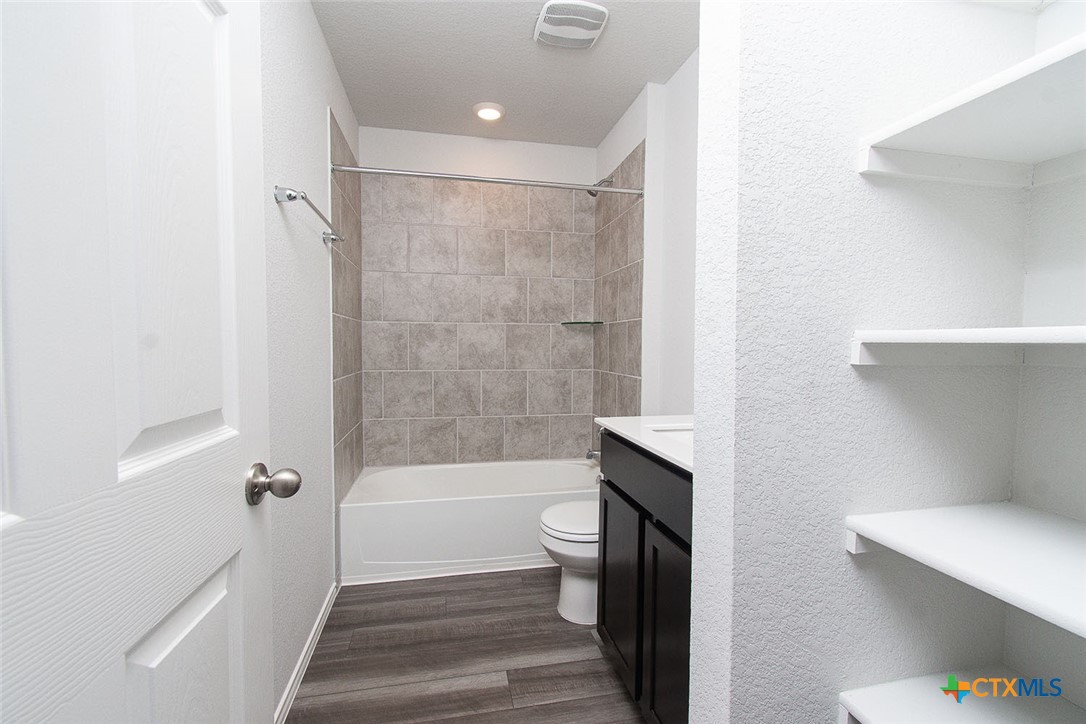 1717 Cedrus Drive Belton, TX 76513 - Photo 11 of 23 a bathroom with a shower a toilet and bathtub
