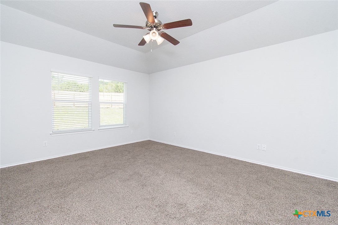1717 Cedrus Drive Belton, TX 76513 - Photo 13 of 23 an empty room with a window and a fan