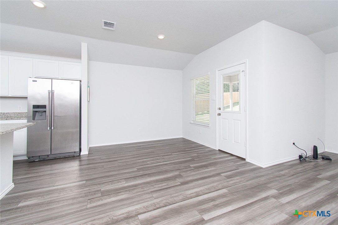 1717 Cedrus Drive Belton, TX 76513 - Photo 6 of 23 a view of empty room with wooden floor