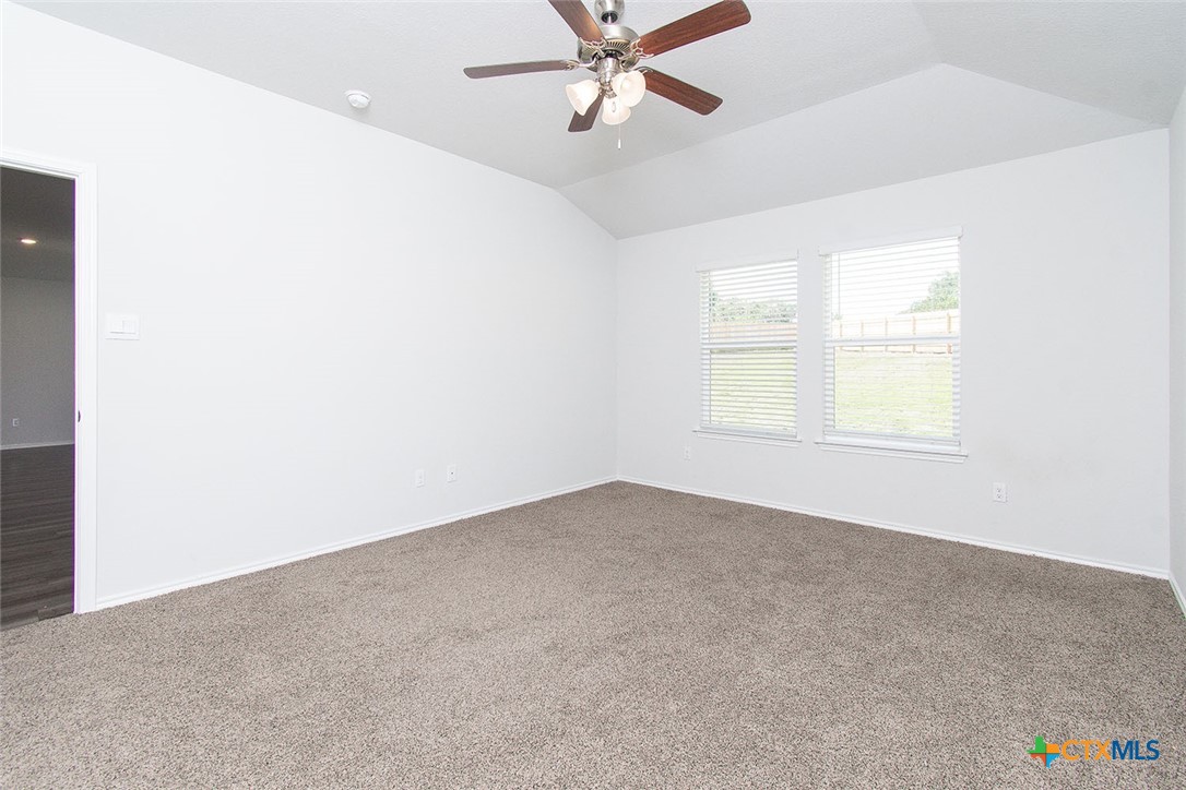 1717 Cedrus Drive Belton, TX 76513 - Photo 9 of 23 an empty room with windows and fan