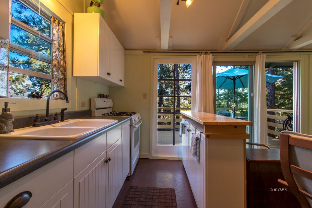 52830 Cedar Crest Drive Pine Cove, CA 92549 - Photo 12 of 31 a kitchen with a sink stove and cabinets