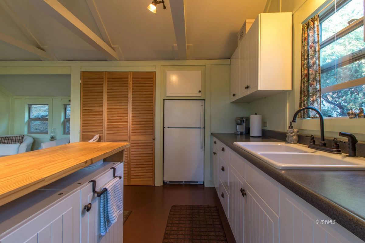 52830 Cedar Crest Drive Pine Cove, CA 92549 - Photo 15 of 31 a kitchen with a sink and refrigerator